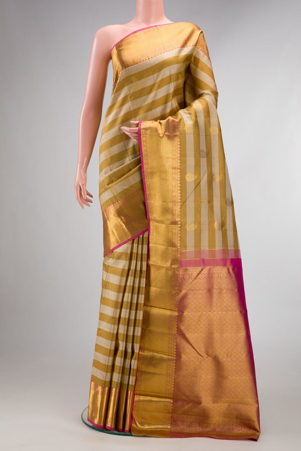 Pure Silk Mustard Kanjivaram Saree with Stripes on the body and Zari Border.  displayed on a mannequin