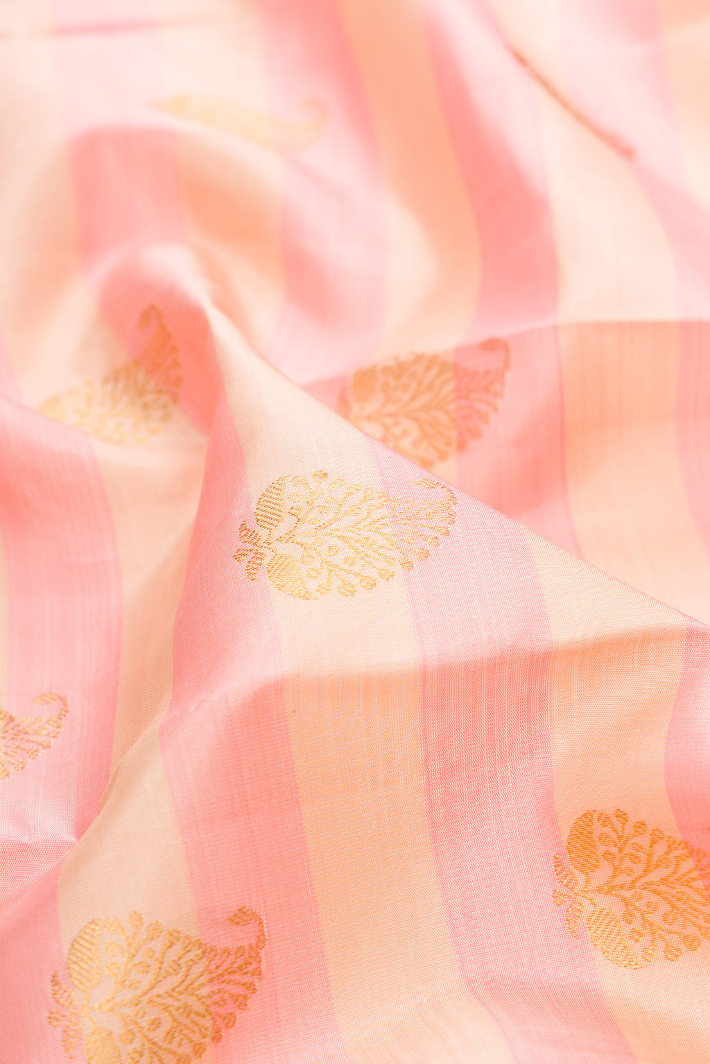 Close up of Pure Silk Pink and sandal Color Kanjivaram Saree with Stripes on the body and Zari Border.  displaying folds