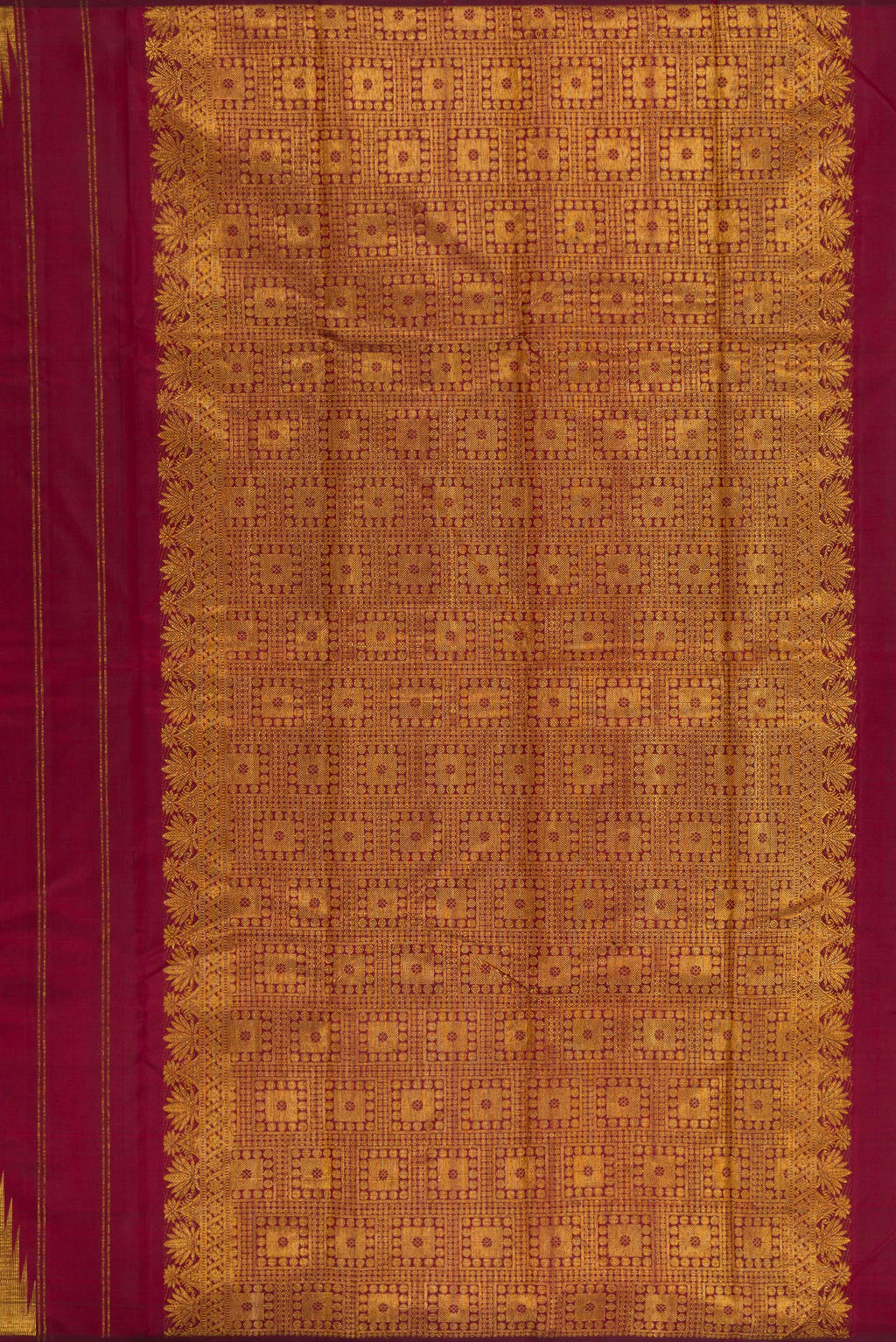 Close up image of the pallu of Pure Silk Maroon Kanjivaram Saree with Zari Butta on the body and Temple Border. 