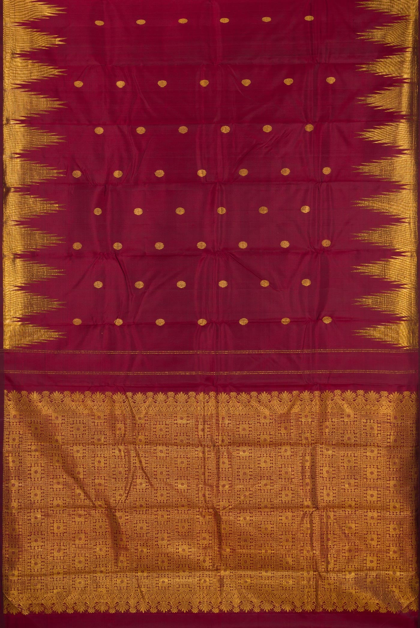 Flat view of Pure Silk Maroon Kanjivaram Saree with Zari Butta on the body and Temple Border. 