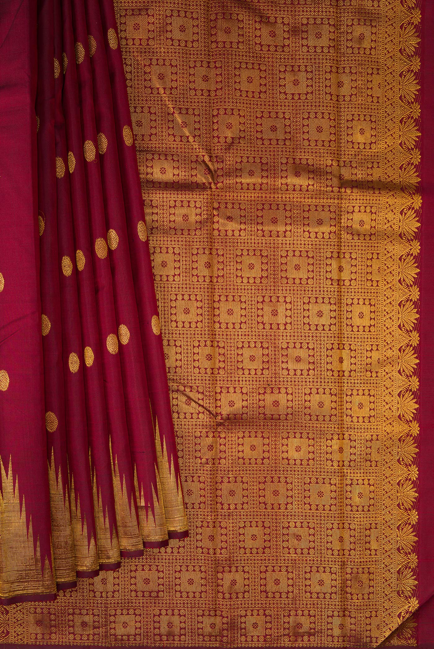 Pleats and pallu of Pure Silk Maroon Kanjivaram Saree with Zari Butta on the body and Temple Border. 