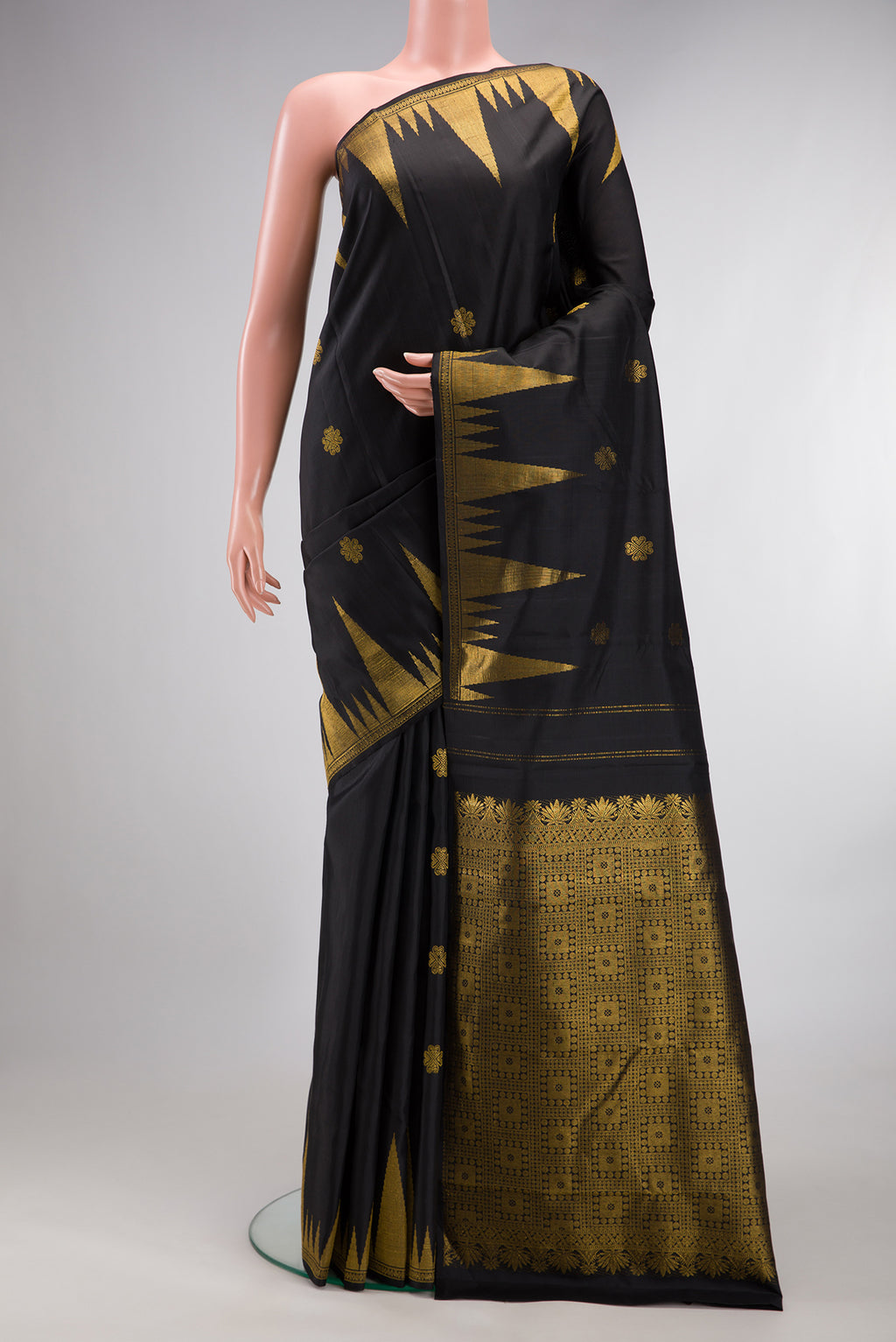 Pure Silk Pure Zari Black Dual Tone Kanjivaram Saree with Zari Butta on the body and Zari Border.  displayed on a mannequin