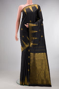 Pure Silk Pure Zari Black Dual Tone Kanjivaram Saree with Zari Butta on the body and Zari Border.  displayed on a mannequin