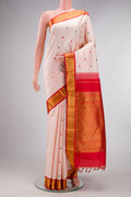 Pure Silk Rose Gold Kanjivaram Saree with Thread Butta on the body and Zari Border.  displayed on a mannequin