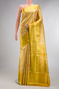 Gold Dual Tone Kanjivaram Tissue Saree with Zari Brocade on the body and Zari Border.  displayed on a mannequin