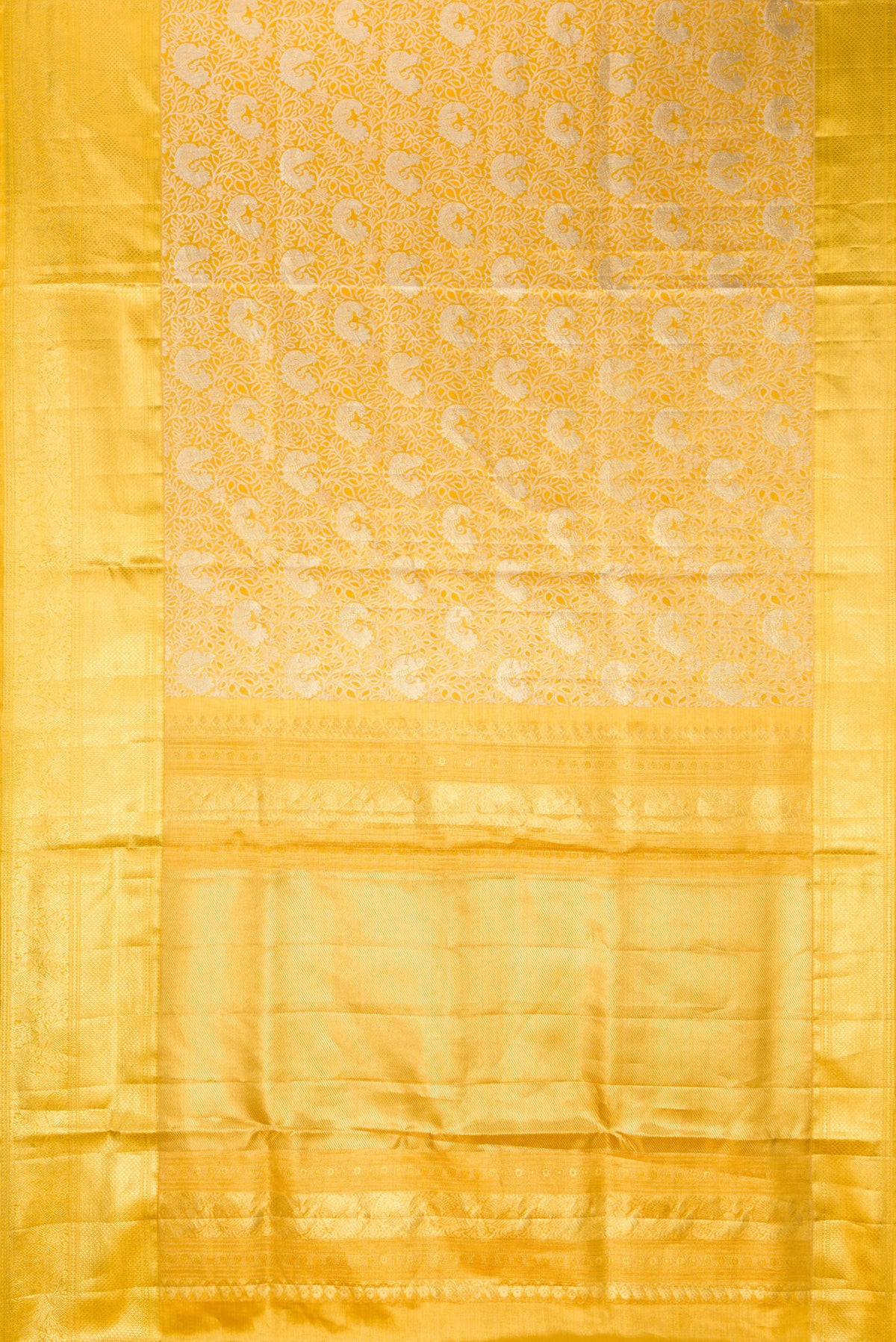 Flat view of Gold Dual Tone Kanjivaram Tissue Saree with Zari Brocade on the body and Zari Border. 