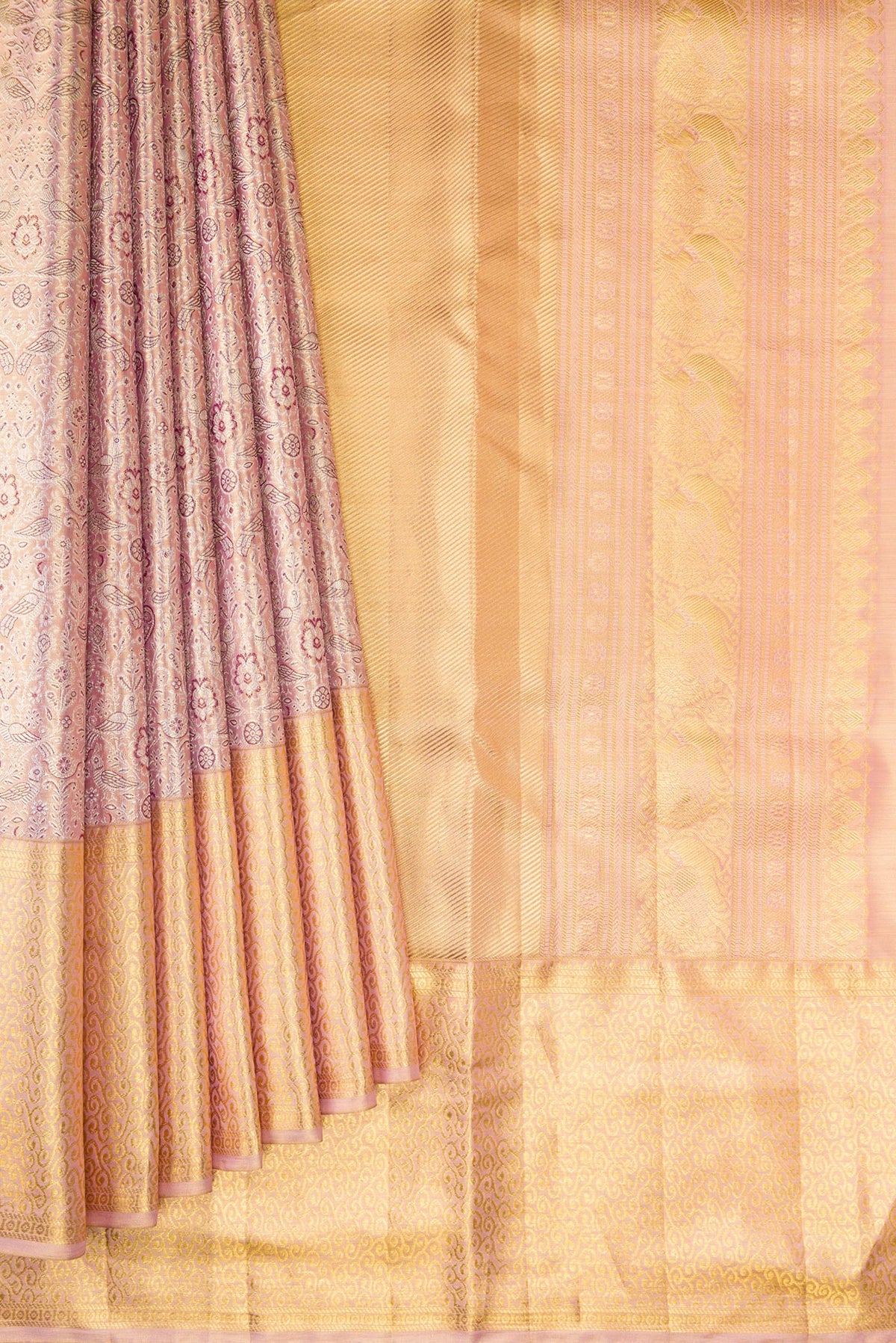Pleats and pallu of Rose Gold Dual Tone Kanjivaram Tissue Saree with Zari Brocade on the body and Zari Border. 