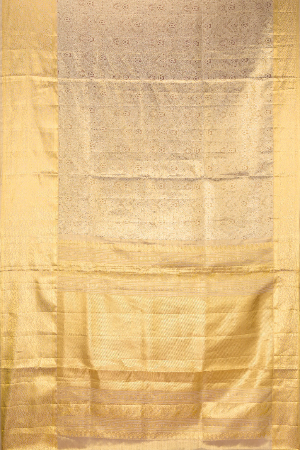 Flat view of Gold Dual Tone Kanjivaram Tissue Saree with Zari Brocade on the body and Zari Border. 