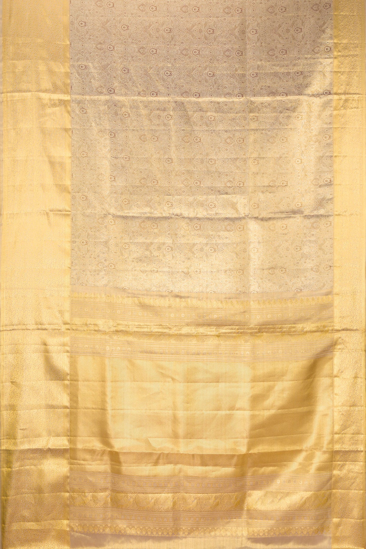 Flat view of Gold Dual Tone Kanjivaram Tissue Saree with Zari Brocade on the body and Zari Border. 