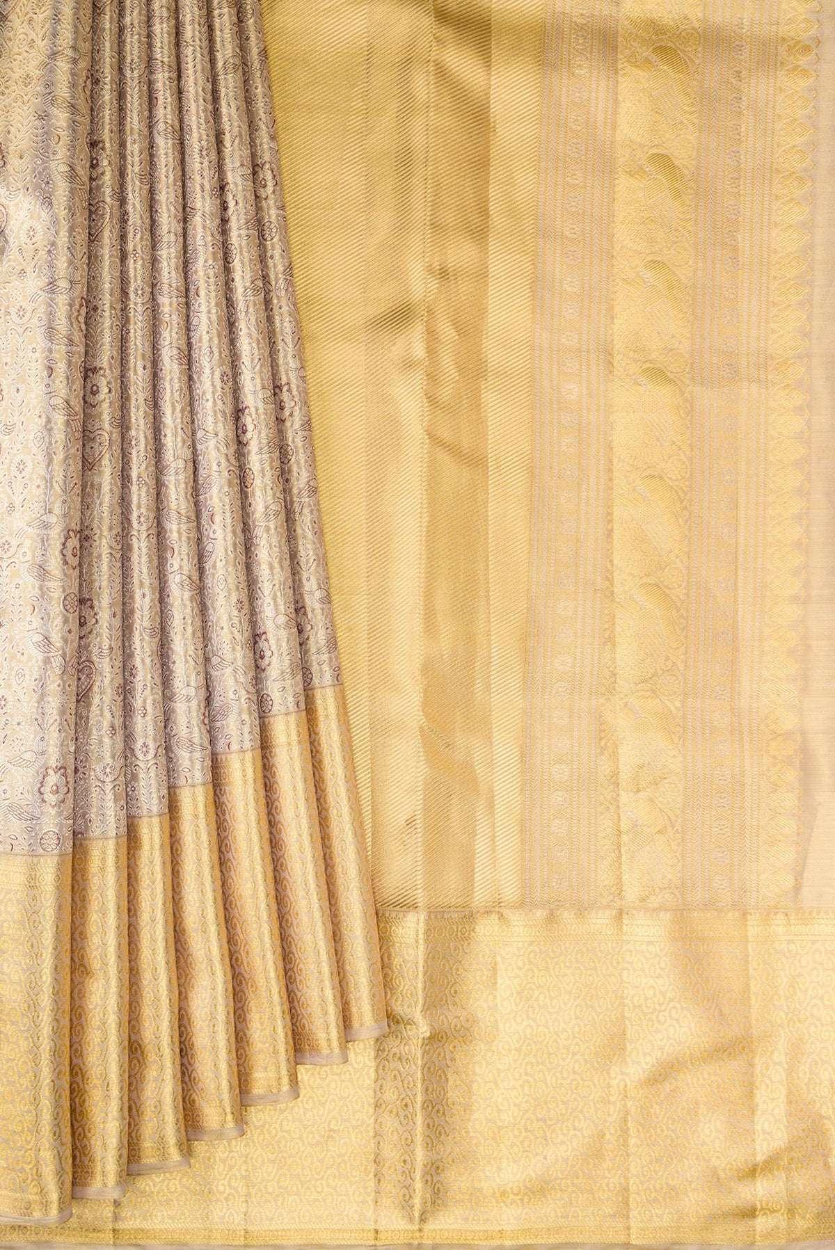 Pleats and pallu of Gold Dual Tone Kanjivaram Tissue Saree with Zari Brocade on the body and Zari Border. 