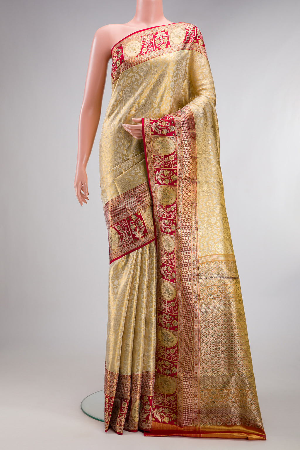 Pure Silk Gold Dual Tone Kanchipuram Tissue Saree with Zari Brocade on the body and Fancy Border.  displayed on a mannequin