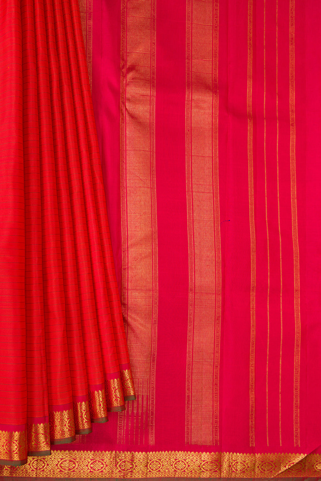 Pleats and pallu of Pure Silk Brick Orange Dual Tone Kanchipuram Saree with Stripes on the body and Zari Border. 