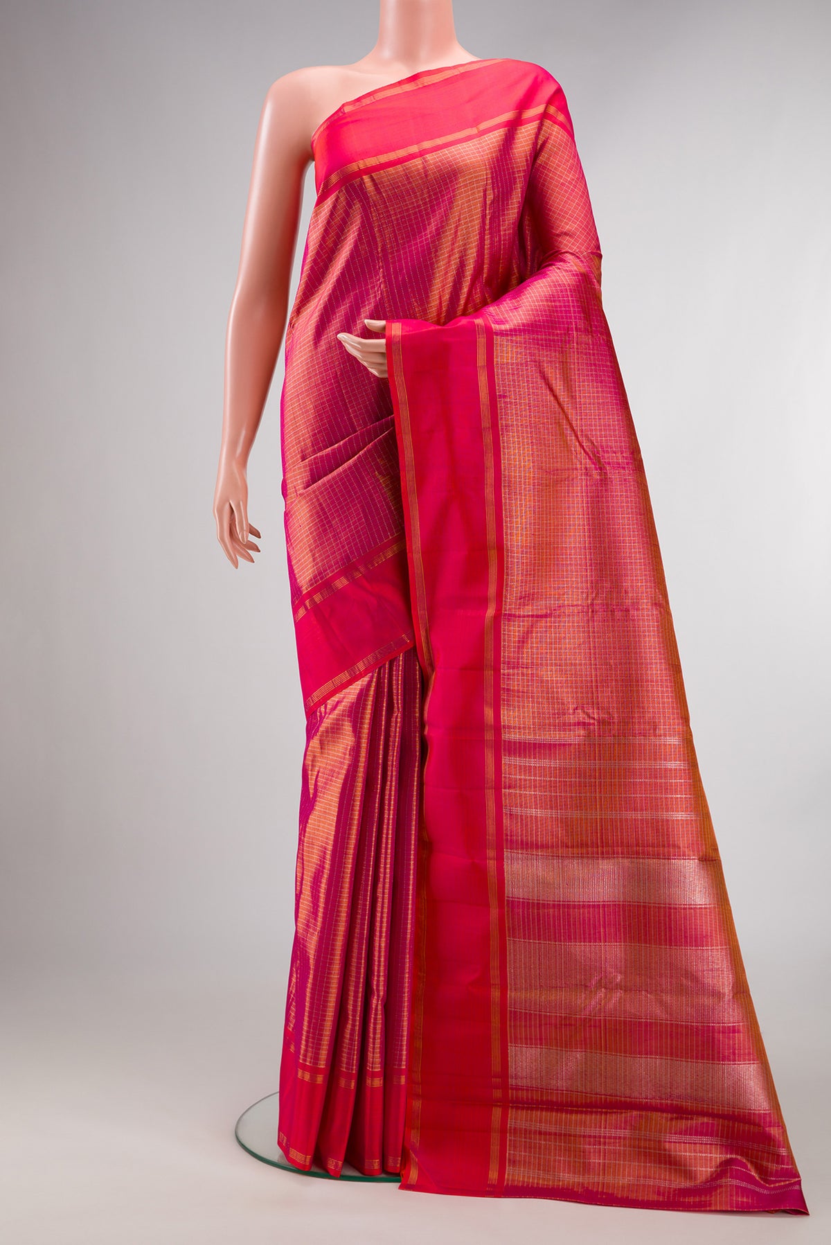 Pure Silk Pink Kanjivaram Saree with Checked design on the body and Zari Border.  displayed on a mannequin