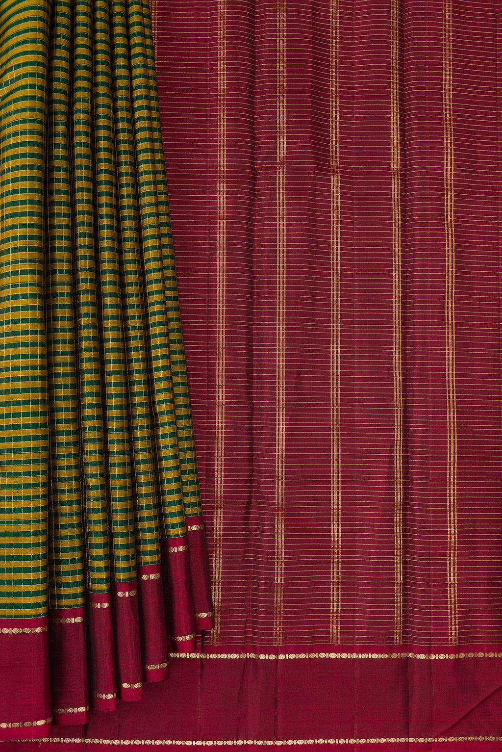 Pleats and pallu of Pure Silk Bottle Green Kanjivaram Saree with Checked design on the body and Zari Border. 