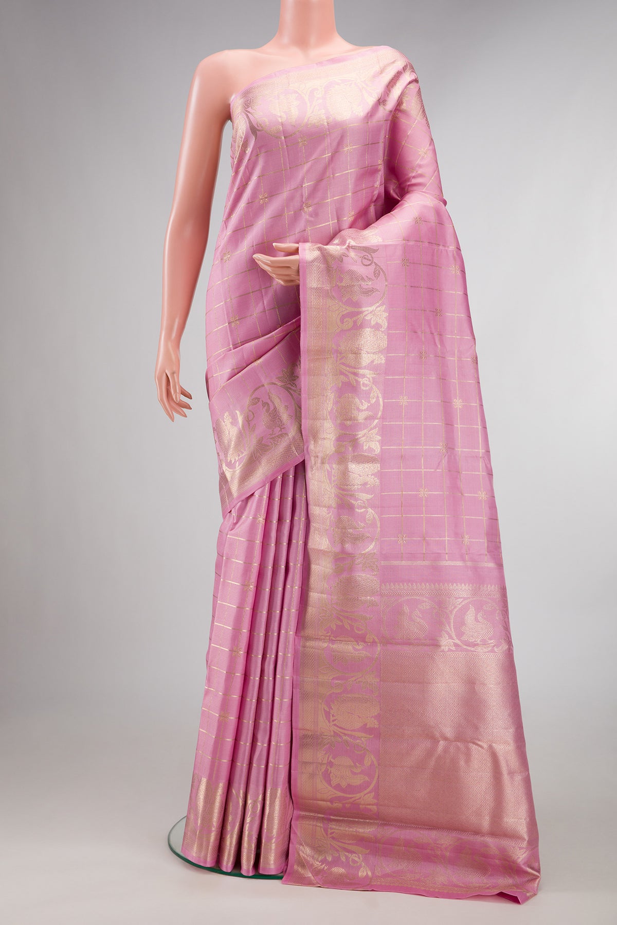 Pure Silk Pink Kanjivaram Saree with Checked design on the body and Fancy Border.  displayed on a mannequin