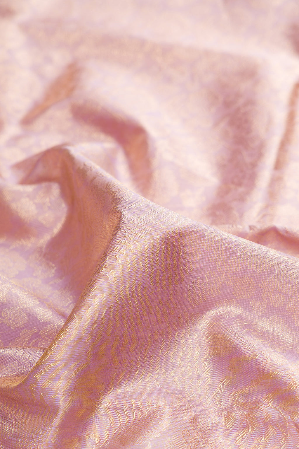 Close up of Lavender Kanchipuram Tissue Saree with Zari Brocade on the body and Fancy Border.  displaying folds