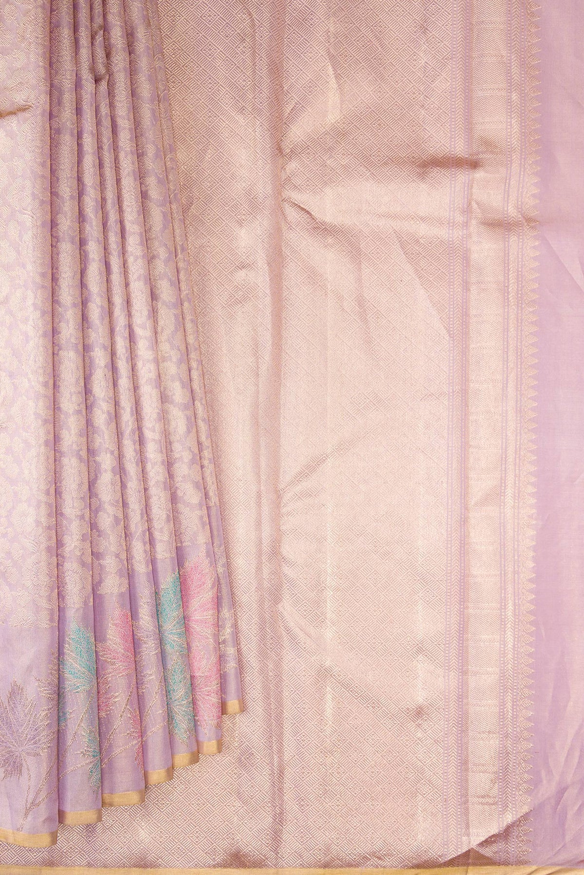 Pleats and pallu of Lavender Kanchipuram Tissue Saree with Zari Brocade on the body and Fancy Border. 
