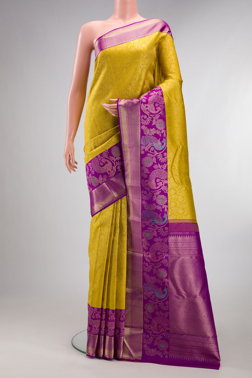 Pure Silk Gold Dual Tone Kanchipuram Saree with Zari Brocade on the body and Fancy Border.  displayed on a mannequin