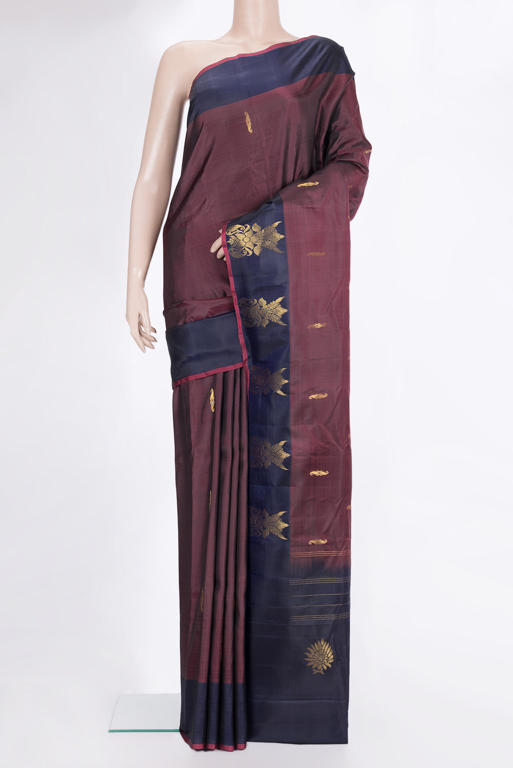 Pure Silk Maroon Dual Tone Kanchipuram Saree with Zari Butta on the body and Fancy Border.  displayed on a mannequin