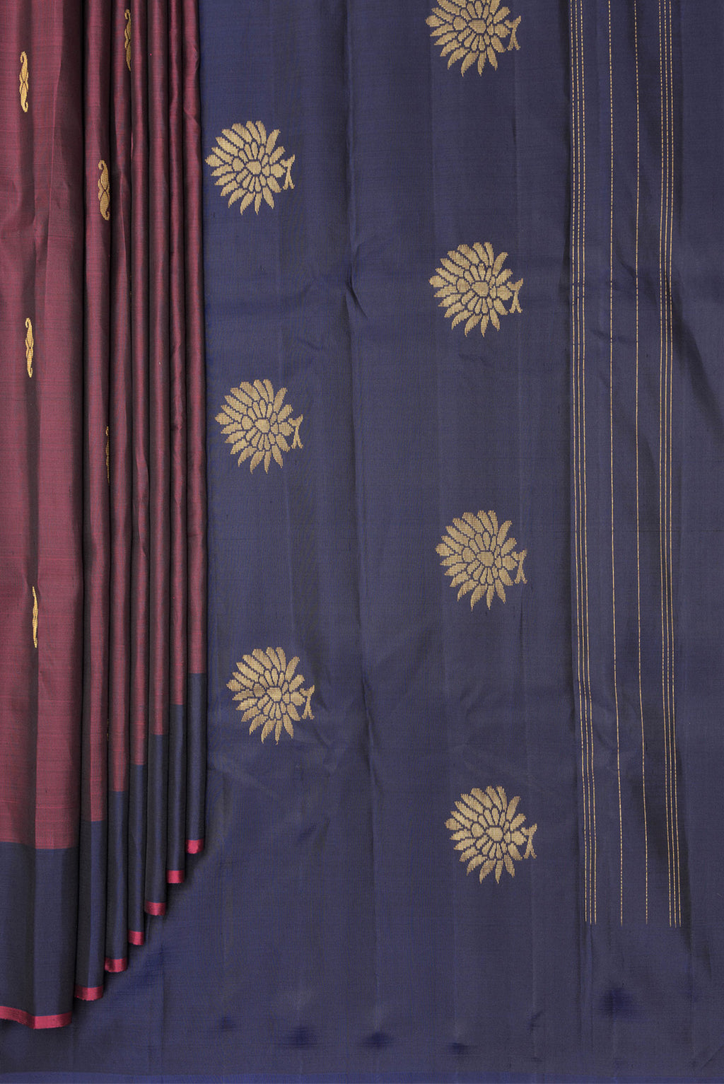 Pleats and pallu of Pure Silk Maroon Dual Tone Kanchipuram Saree with Zari Butta on the body and Fancy Border. 