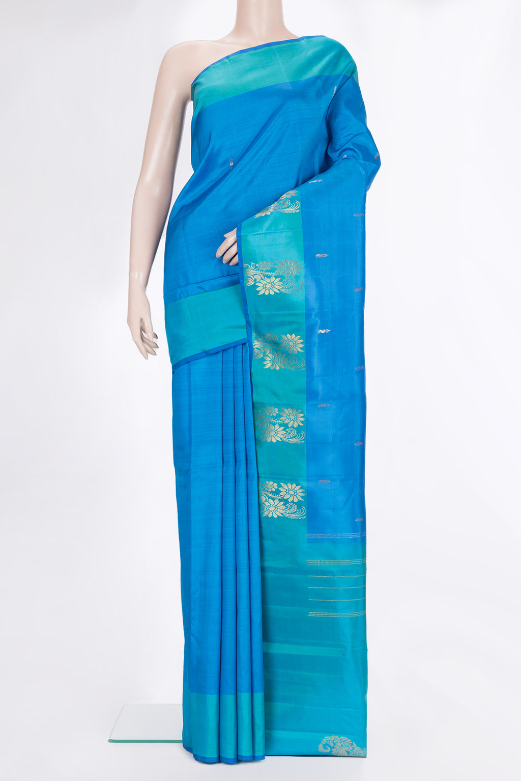 Pure Silk Sky Blue Dual Tone Kanchipuram Saree with Zari Butta on the body and Fancy Border.  displayed on a mannequin