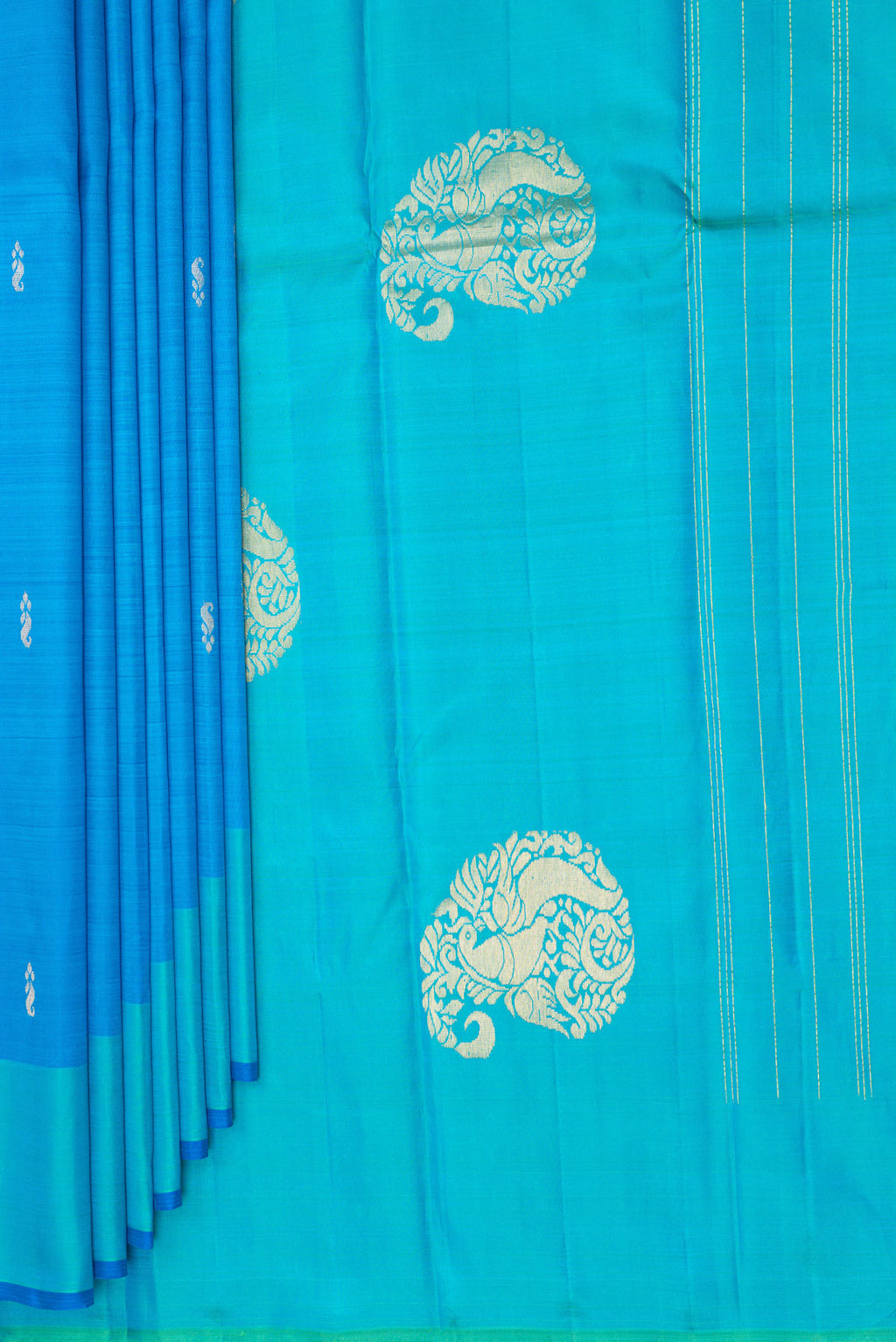 Pleats and pallu of Pure Silk Sky Blue Dual Tone Kanchipuram Saree with Zari Butta on the body and Fancy Border. 