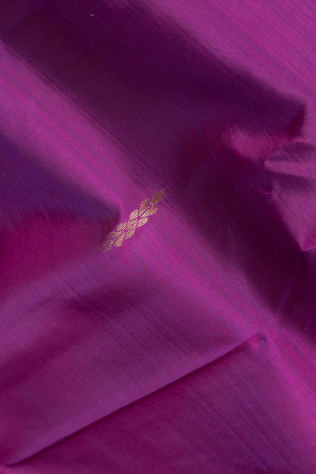 Close up of Pure Silk Purple Kanchipuram Saree with Zari Butta on the body and Fancy Border.  displaying folds
