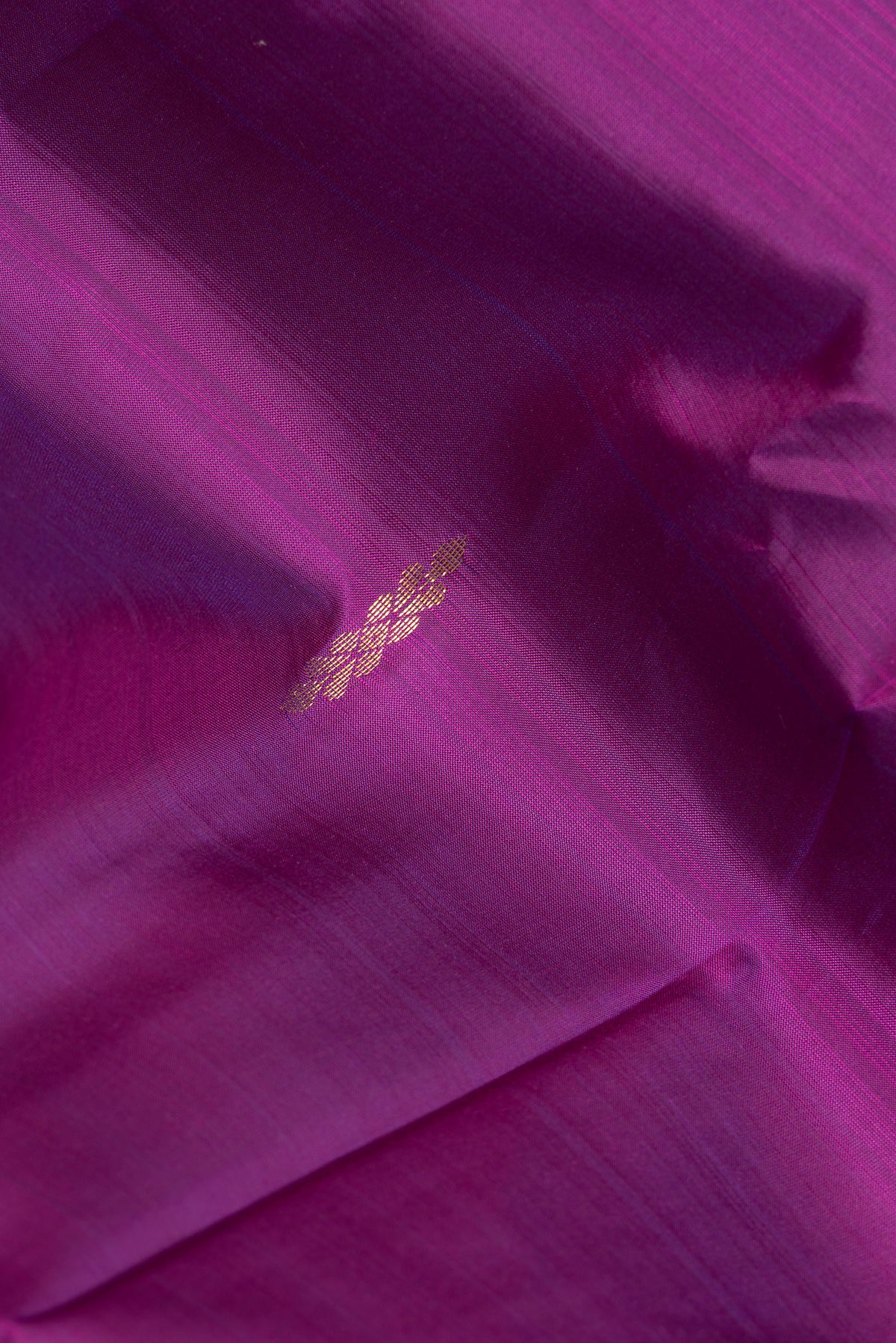 Close up of Pure Silk Purple Kanchipuram Saree with Zari Butta on the body and Fancy Border.  displaying folds