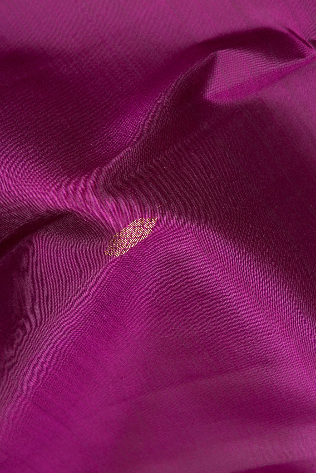 Close up of Pure Silk Purple Kanchipuram Saree with Zari Butta on the body and Fancy Border.  displaying folds