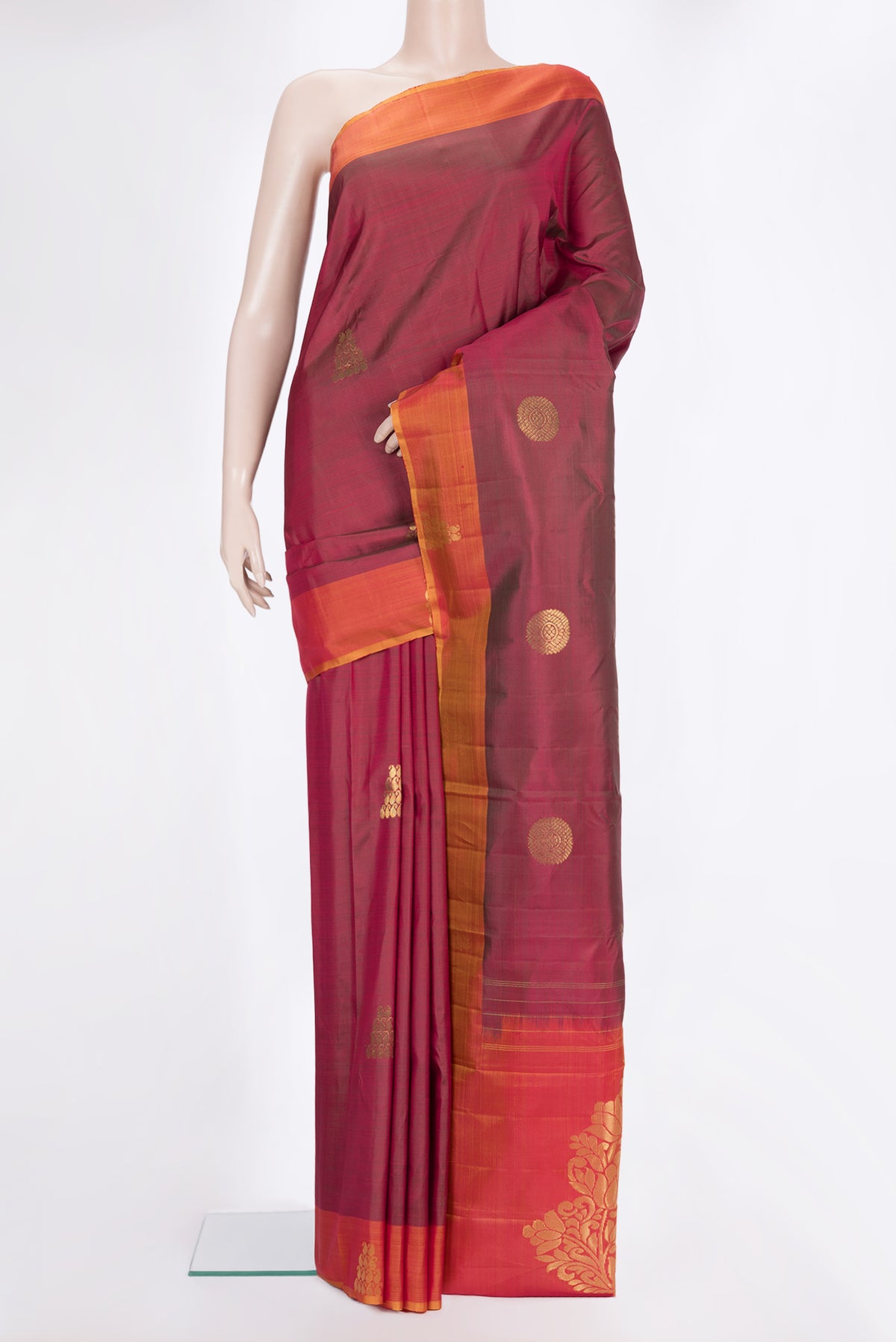 Pure Silk Maroon Kanchipuram Saree with Zari Butta on the body and Fancy Border.  displayed on a mannequin