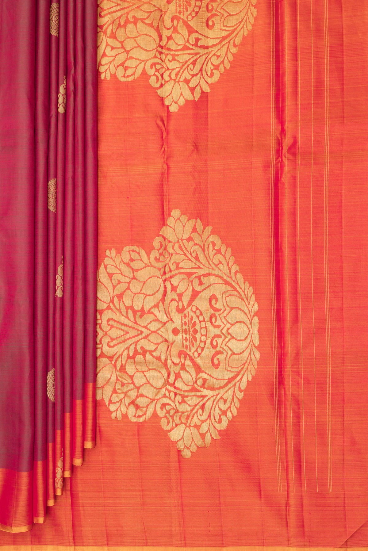 Pleats and pallu of Pure Silk Maroon Kanchipuram Saree with Zari Butta on the body and Fancy Border. 