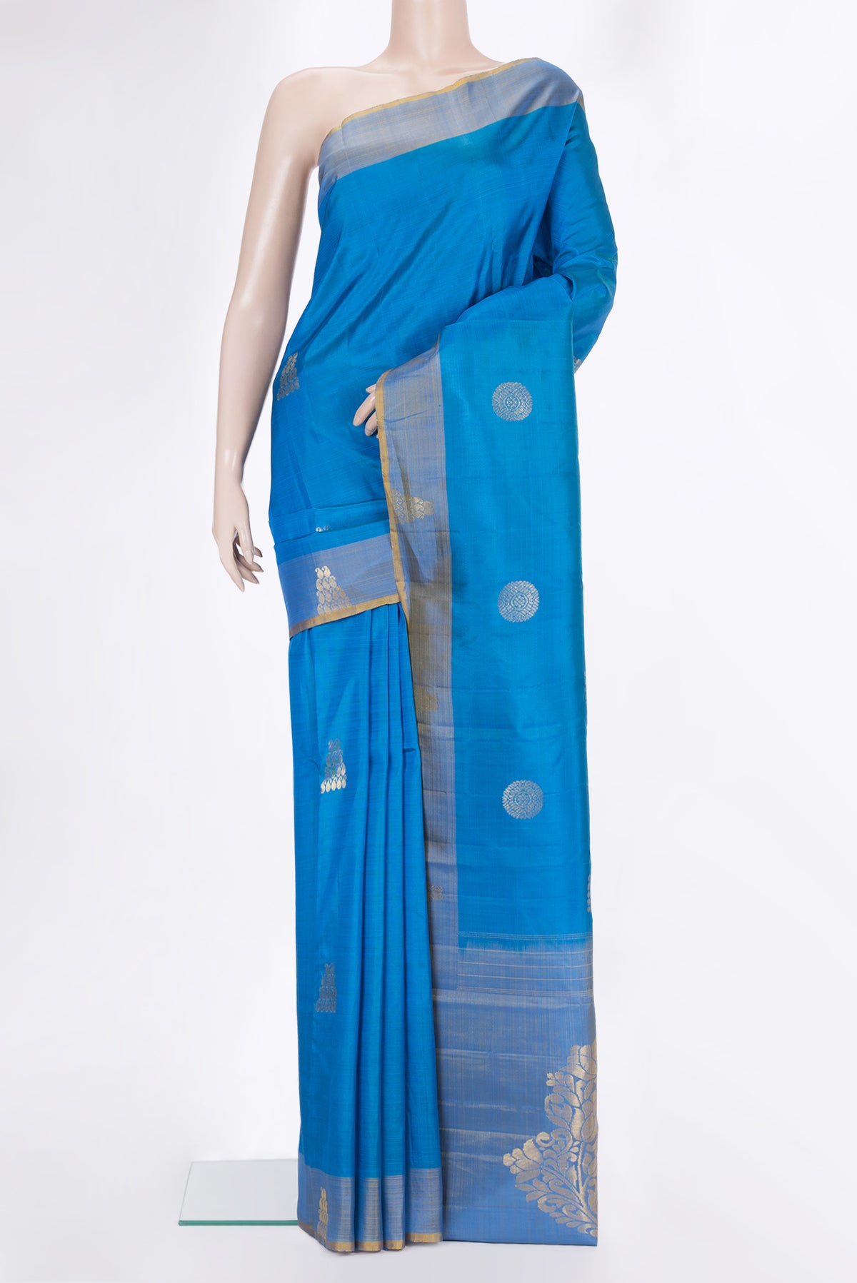 Pure Silk Sky Blue Dual Tone Kanchipuram Saree with Zari Butta on the body and Fancy Border.  displayed on a mannequin
