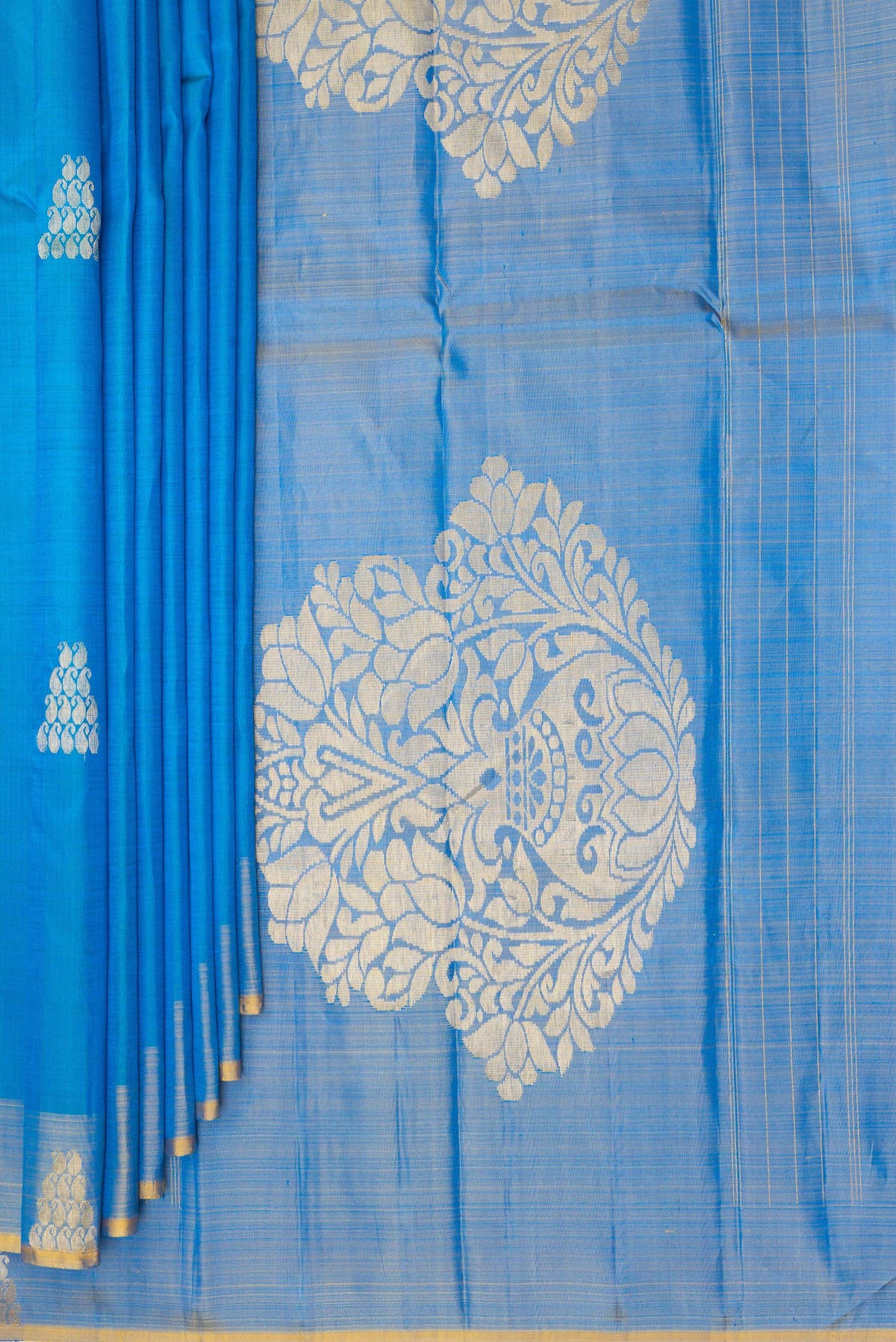 Pleats and pallu of Pure Silk Sky Blue Dual Tone Kanchipuram Saree with Zari Butta on the body and Fancy Border. 