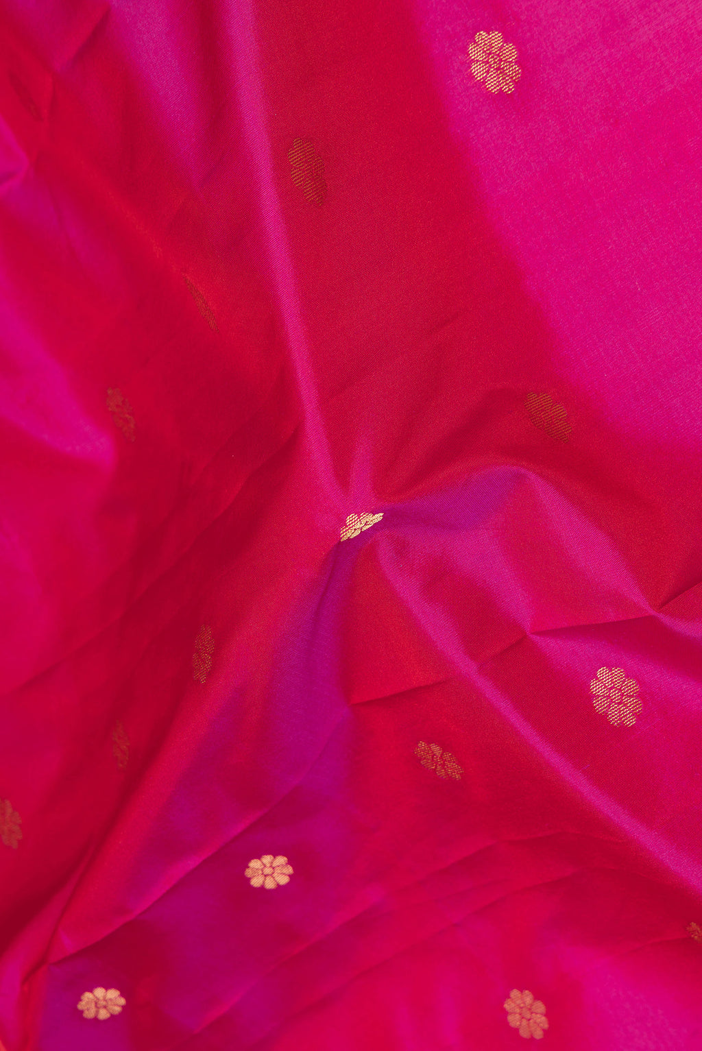 Close up of Pink Dual Tone Blended Paithani Silk Saree with Zari Butta on the body and Zari Border.  displaying folds