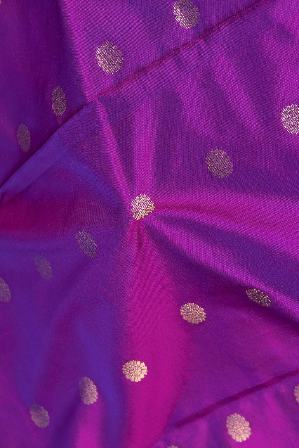 Close up of Purple Blended Paithani Silk Saree with Zari Butta on the body and Zari Border.  displaying folds