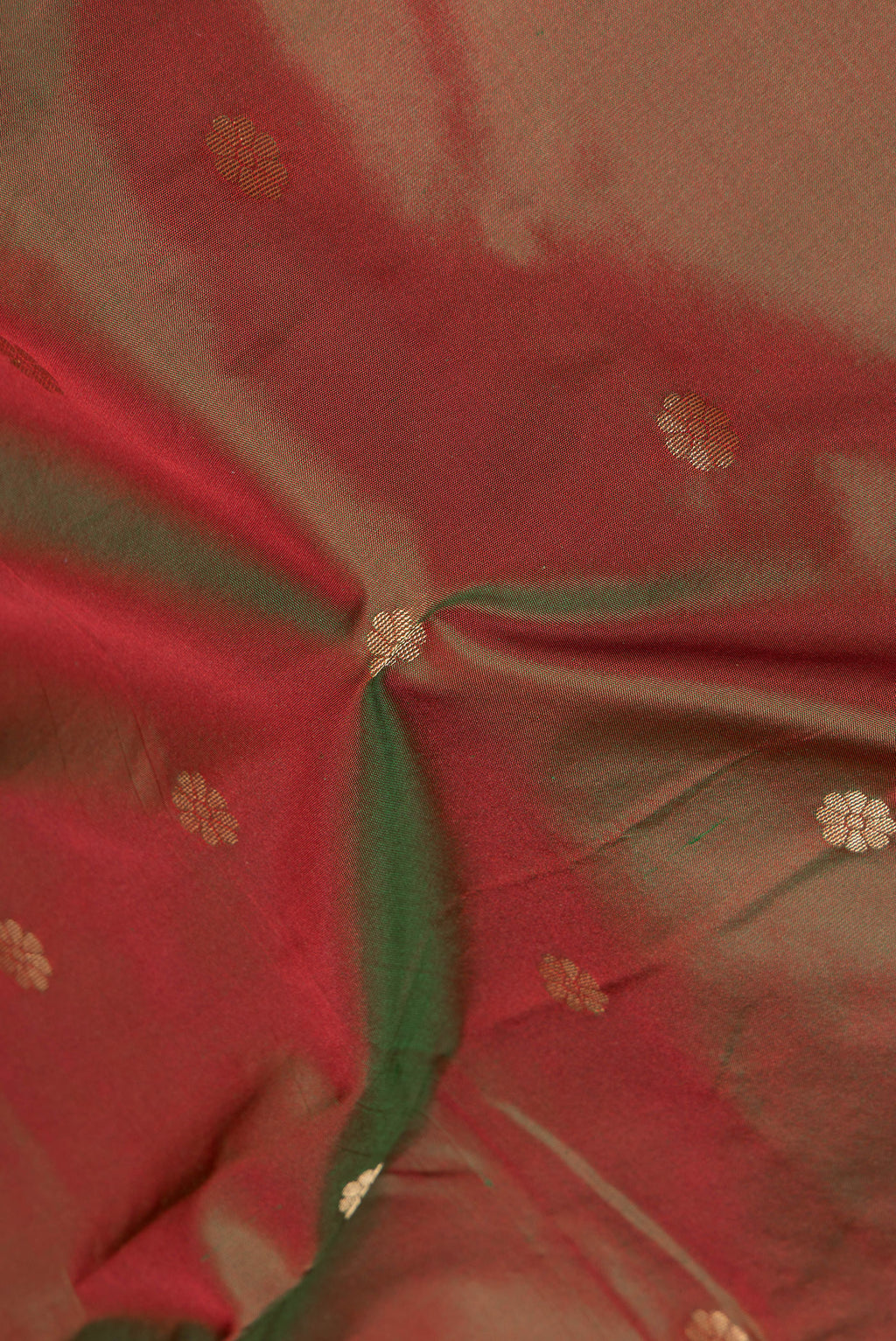 Close up of Mehandi Green Dual Tone Blended Paithani Silk Saree with Zari Butta on the body and Zari Border.  displaying folds