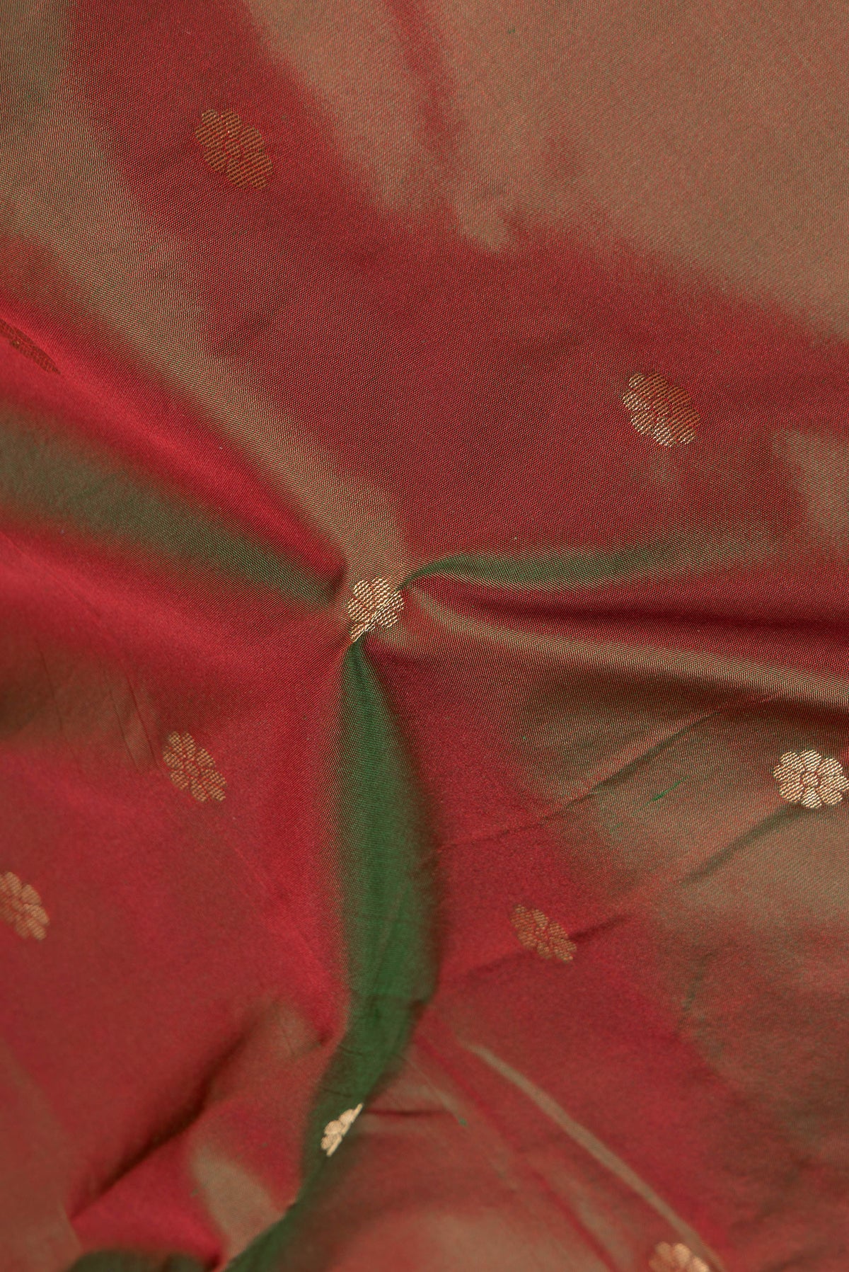 Close up of Mehandi Green Dual Tone Blended Paithani Silk Saree with Zari Butta on the body and Zari Border.  displaying folds