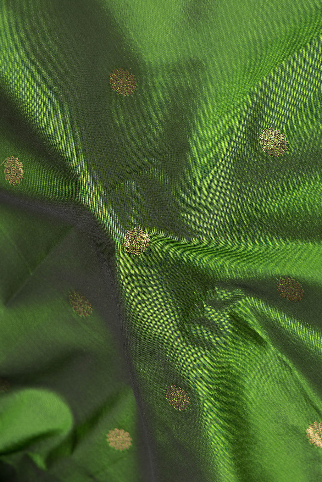 Close up of Mehandi Green Blended Paithani Silk Saree with Zari Butta on the body and Zari Border.  displaying folds