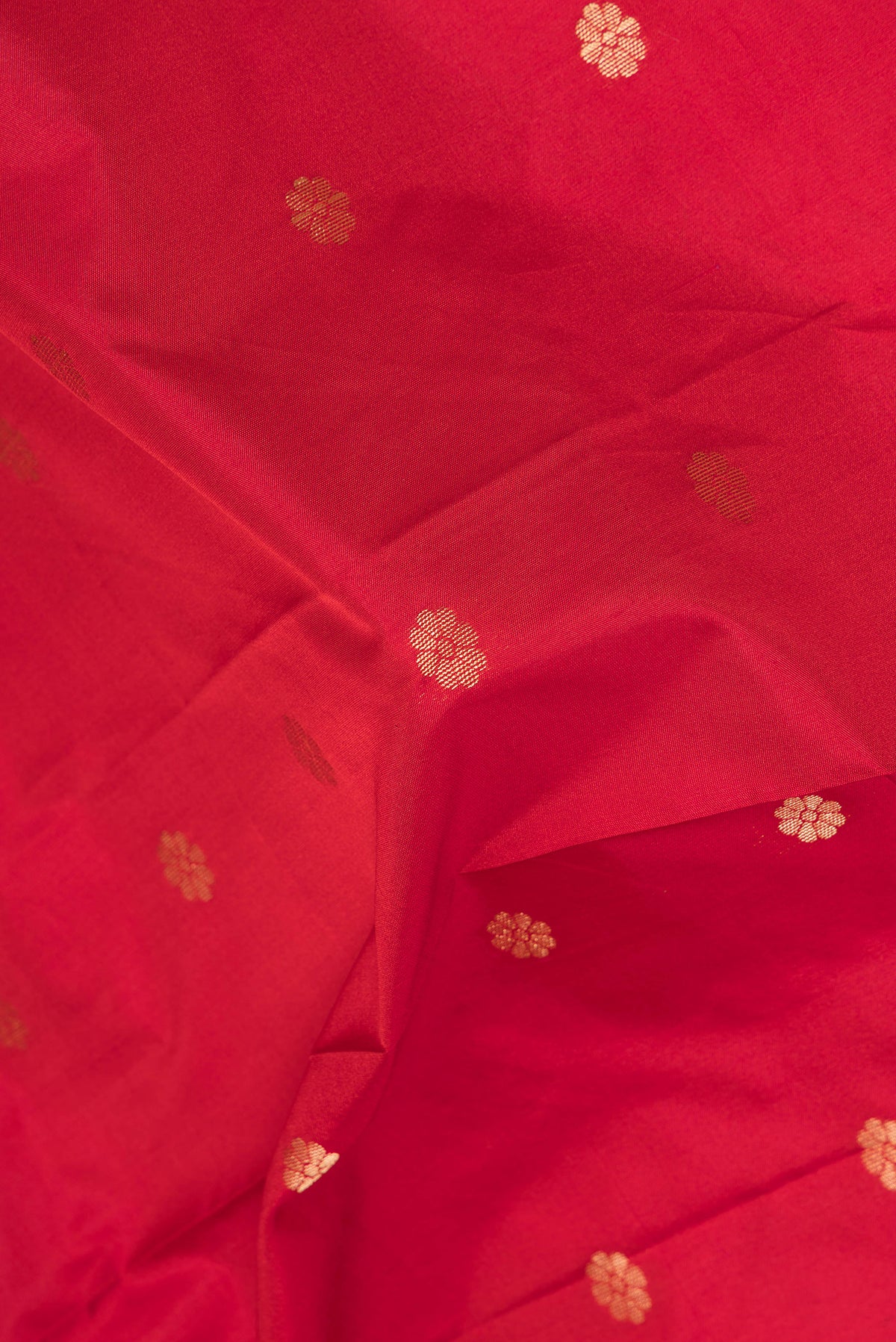 Close up of Red Blended Paithani Silk Saree with Zari Butta on the body and Zari Border.  displaying folds