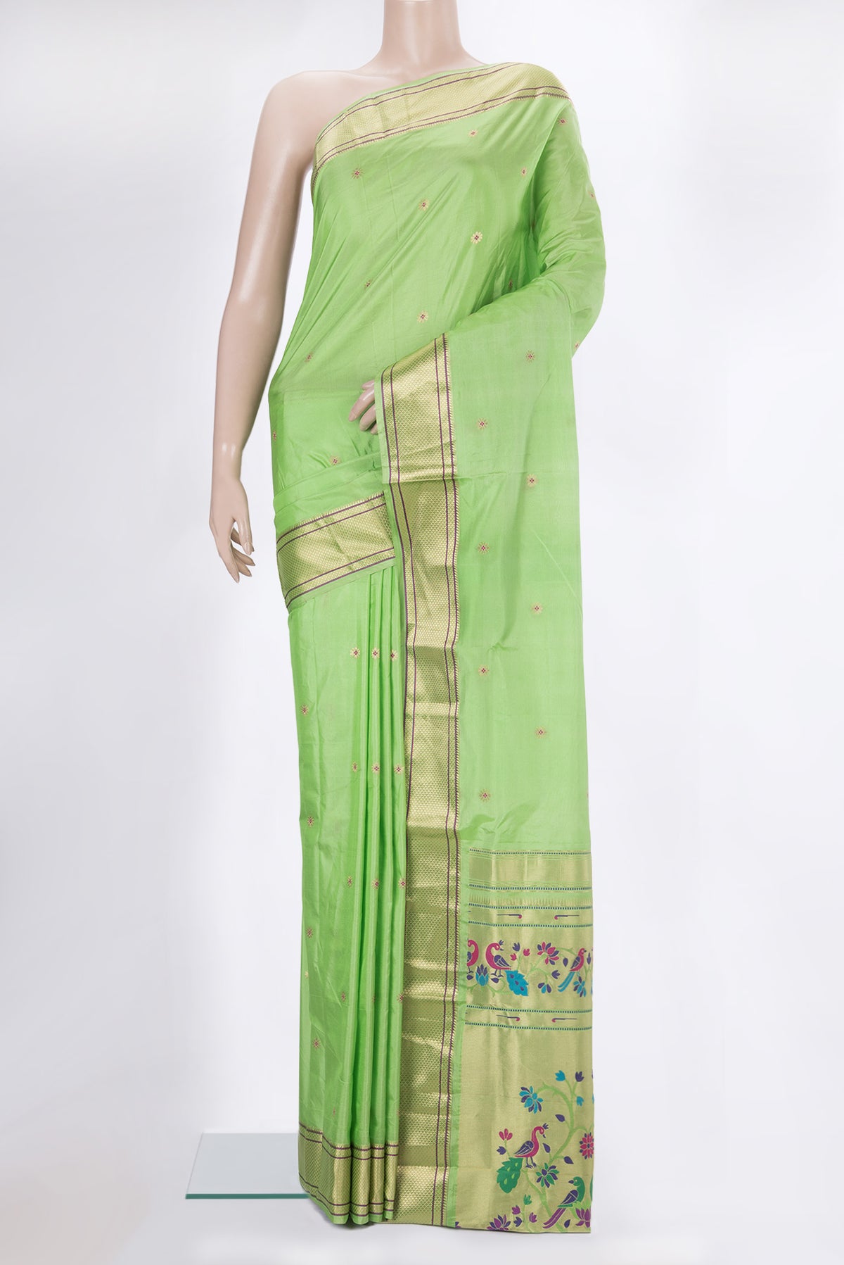 Pista Green Blended Paithani Silk Saree with Zari Butta on the body and Zari Border.  displayed on a mannequin