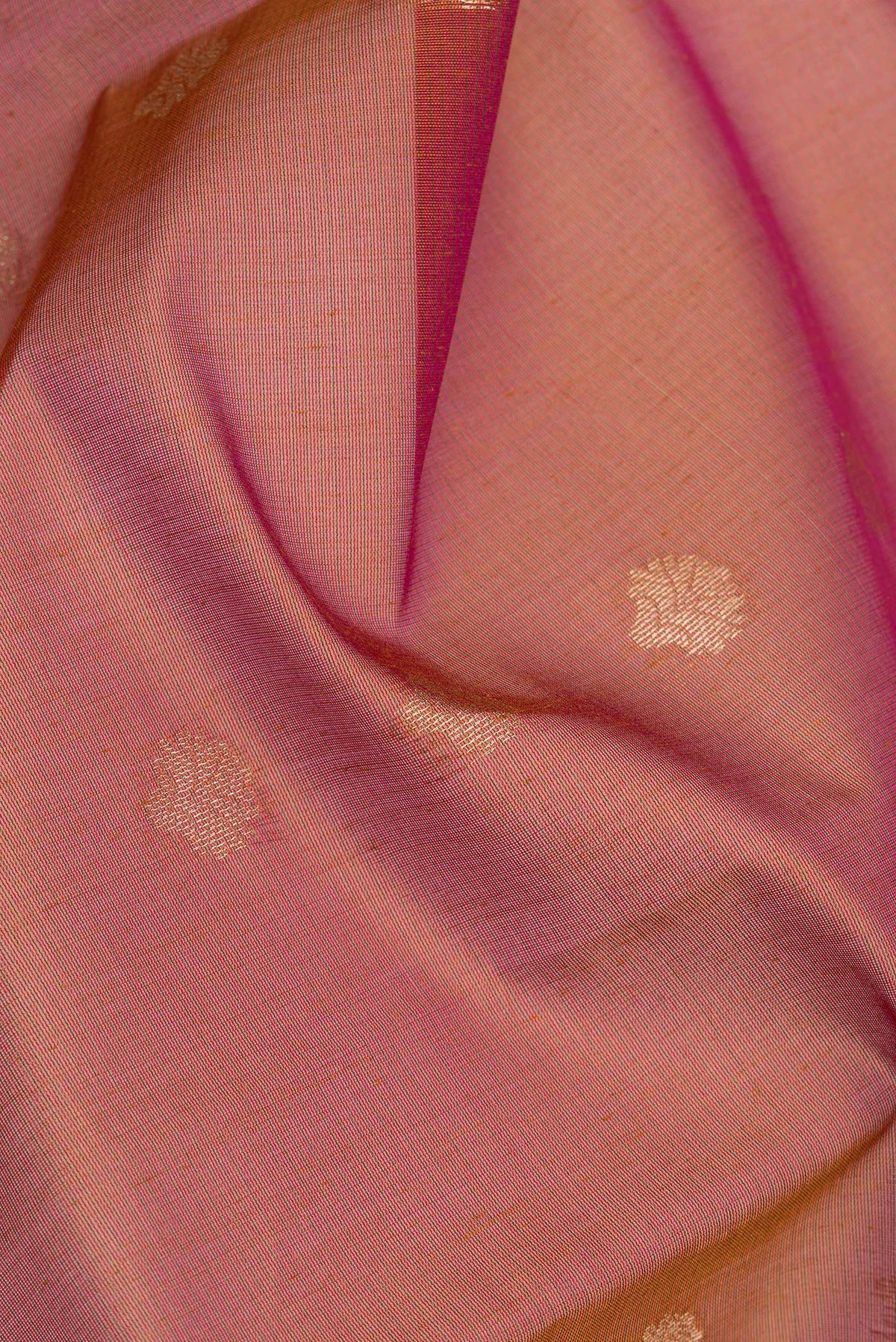 Close up of Mustard Dual Tone Silk Cotton Saree with Zari Butta on the body and Zari Border.  displaying folds