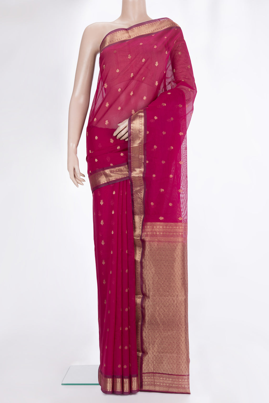 Dark Pink Silk Cotton Saree with Zari Butta on the body and Zari Border.  displayed on a mannequin