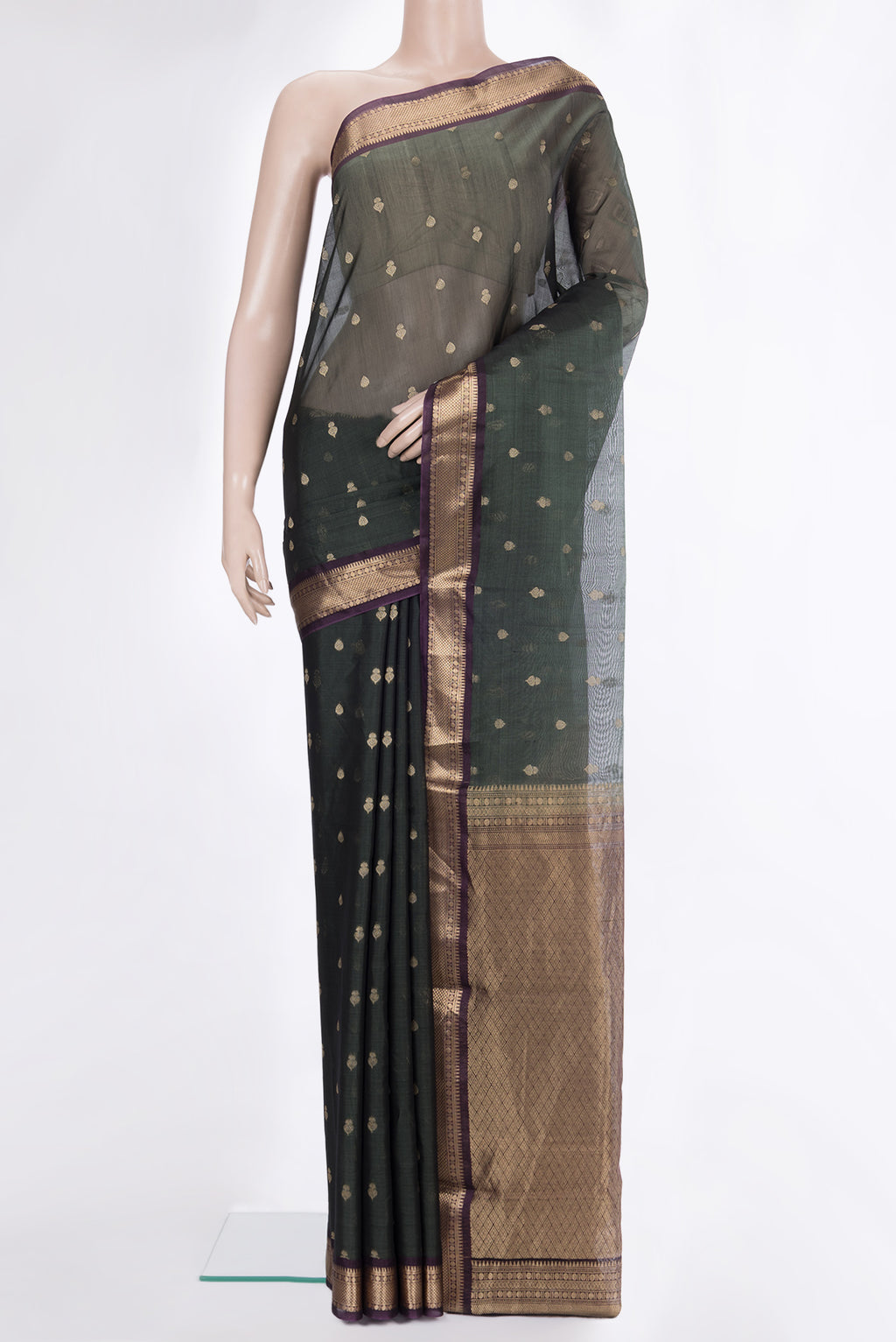 Green Silk Cotton Saree with Zari Butta on the body and Zari Border.  displayed on a mannequin