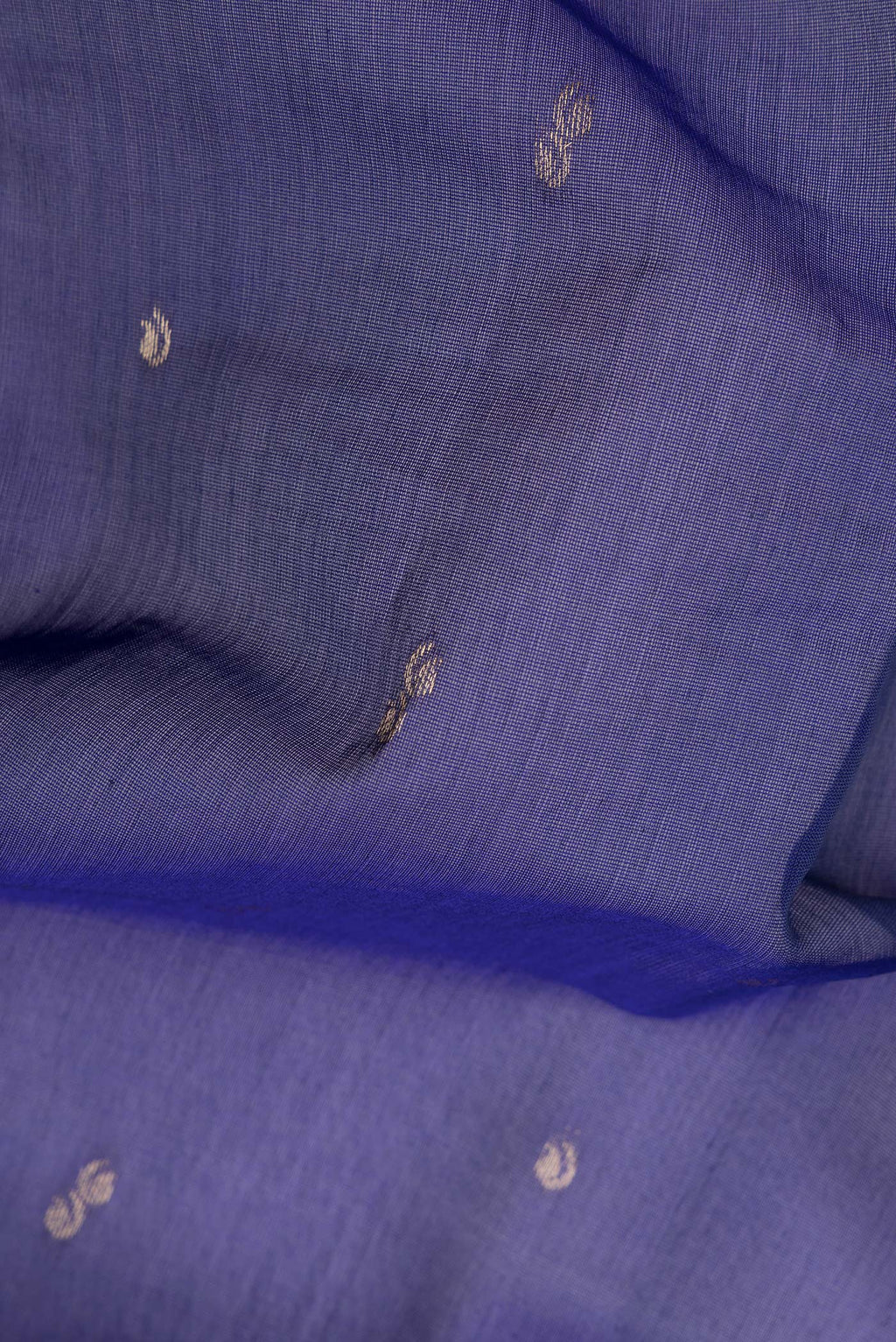 Close up of Royal Blue Silk Cotton Saree with Zari Butta on the body and Zari Border.  displaying folds
