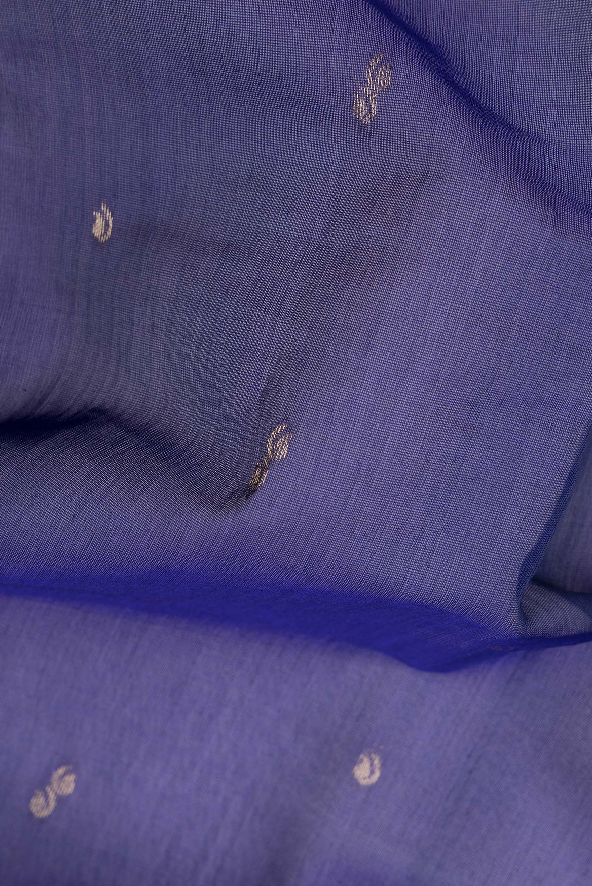 Close up of Royal Blue Silk Cotton Saree with Zari Butta on the body and Zari Border.  displaying folds