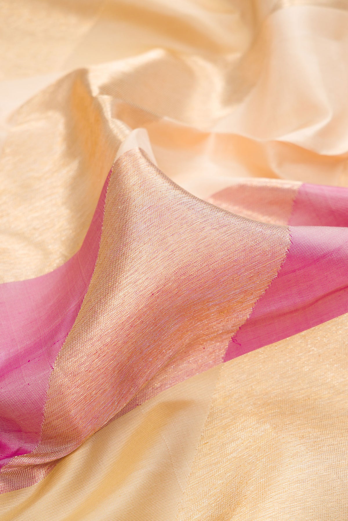 Close up of Pure Silk Sandal and Pink Color Kanchipuram Saree with Zari Brocade on the body and Without Border.  displaying folds
