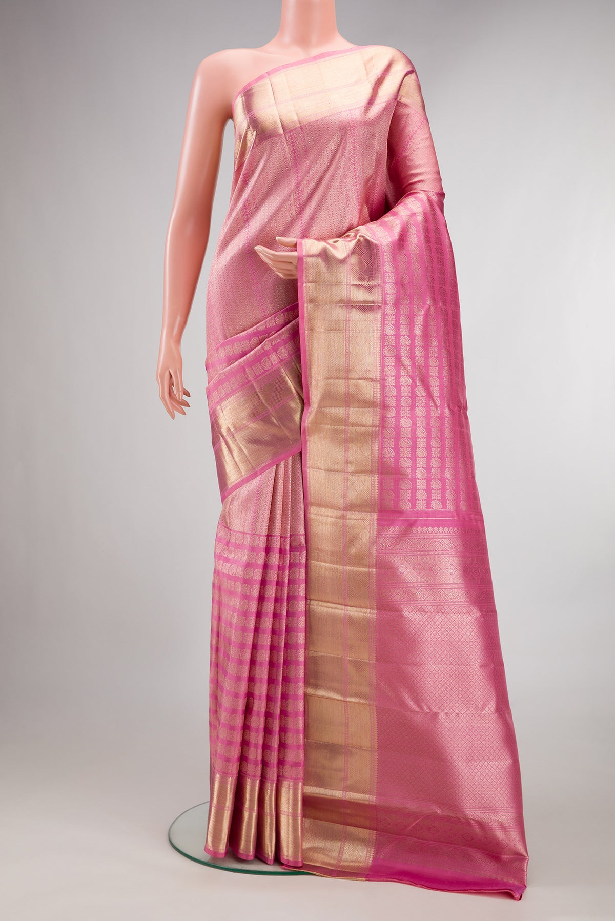 Pure Silk Pink Kanchipuram Saree with Zari Brocade on the body and Zari Border.  displayed on a mannequin