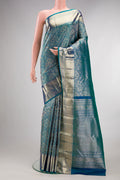 Pure Silk Peacock Blue Dual Tone Kanchipuram Saree with Zari Brocade on the body and Zari Border.  displayed on a mannequin