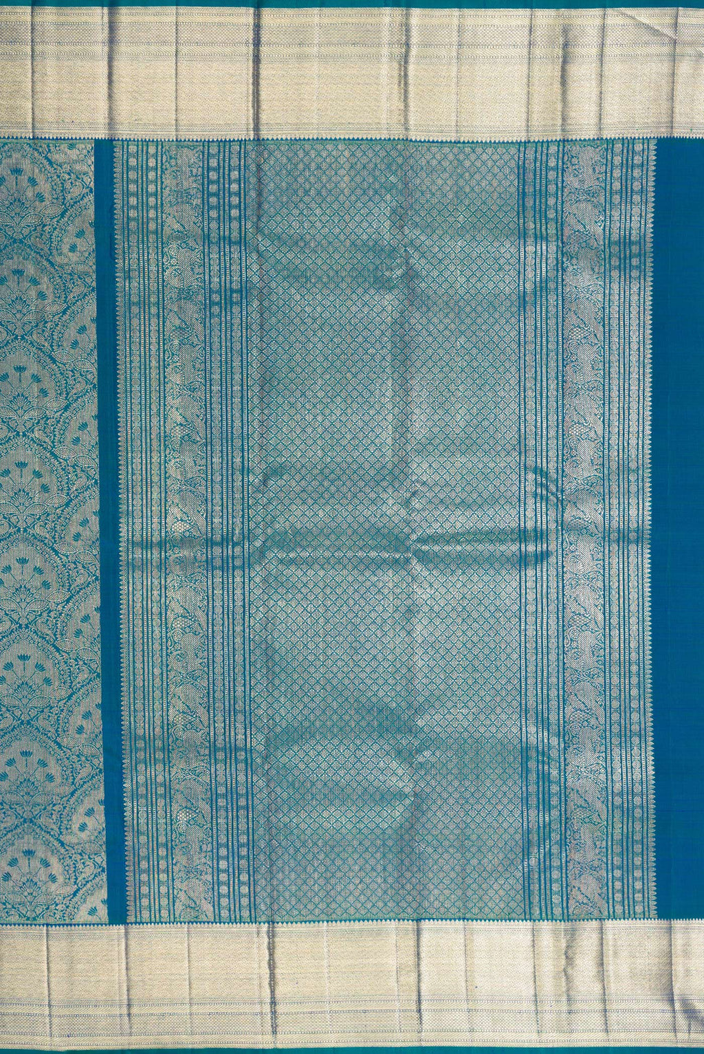Close up image of the pallu of Pure Silk Peacock Blue Dual Tone Kanchipuram Saree with Zari Brocade on the body and Zari Border. 