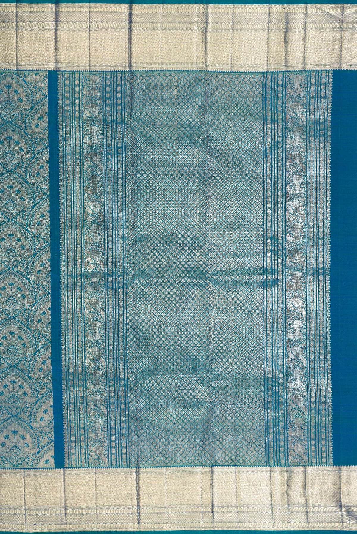 Close up image of the pallu of Pure Silk Peacock Blue Dual Tone Kanchipuram Saree with Zari Brocade on the body and Zari Border. 